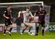 5 April 2024; Dayle Rooney of Bohemians in action against Ben McCormack of Waterford during the SSE Airtricity Men's Premier Division match between Bohemians and Waterford at Dalymount Park in Dublin. Photo by Piaras Ó Mídheach/Sportsfile