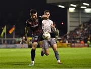 5 April 2024; Jordan Flores of Bohemians in action against Pádraig Amond of Waterford during the SSE Airtricity Men's Premier Division match between Bohemians and Waterford at Dalymount Park in Dublin. Photo by Piaras Ó Mídheach/Sportsfile