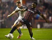 5 April 2024; James Akintunde of Bohemians in action against Darragh Power of Waterford during the SSE Airtricity Men's Premier Division match between Bohemians and Waterford at Dalymount Park in Dublin. Photo by Piaras Ó Mídheach/Sportsfile