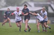 6 April 2024; Cliodhna Ni She of Carlow is tackled by Karen O'Leary, left, and Ellie Woulfe of Limerick during the Lidl LGFA National League Division 4 final match between Carlow and Limerick at St Brendan’s Park in Birr, Offaly. Photo by Ben McShane/Sportsfile