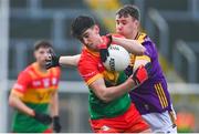 7 April 2024; Niall Hickey of Carlow in action against Niall Hughes of Wexford during the Leinster GAA Football Senior Championship Round 1 match between Wexford and Carlow at Chadwicks Wexford Park in Wexford. Photo by Tyler Miller/Sportsfile