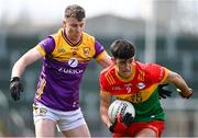 7 April 2024; Niall Hickey of Carlow in action against Niall Hughes of Wexford during the Leinster GAA Football Senior Championship Round 1 match between Wexford and Carlow at Chadwicks Wexford Park in Wexford. Photo by Tyler Miller/Sportsfile