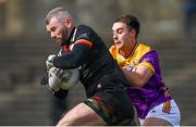 7 April 2024; Carlow goalkeeper Johnny Furey in action against Seán Nolan of Wexford during the Leinster GAA Football Senior Championship Round 1 match between Wexford and Carlow at Chadwicks Wexford Park in Wexford. Photo by Tyler Miller/Sportsfile
