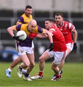 14 April 2024; Kevin O'Grady of Wexford in action against Conall McKeever of Louth during the Leinster GAA Football Senior Championship quarter-final match between Louth and Wexford at Laois Hire O’Moore Park in Portlaoise, Laois. Photo by Piaras Ó Mídheach/Sportsfile