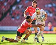 20 April 2024; Charlie Ngatai of Leinster is tackled by Emmanuel Tshituka of Emirates Lions during the United Rugby Championship match between Emirates Lions and Leinster at Emirates Airline Park in Johannesburg, South Africa. Photo by Harry Murphy/Sportsfile