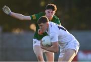 23 April 2024; Mark Gibbons of Kildare in action against Tom Bowden of Meath during the EirGrid Leinster GAA Football U20 Championship semi-final match between Kildare and Meath at Manguard Park at the Kildare GAA Centre of Excellence in Hawkfield, Kildare. Photo by Tyler Miller/Sportsfile