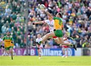 28 April 2024; Jason McGee of Donegal in action against Brian Kennedy of Tyrone during the Ulster GAA Football Senior Championship semi-final match between Donegal and Tyrone at Celtic Park in Derry. Photo by Stephen McCarthy/Sportsfile