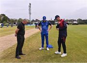 3 May 2024; Umpire Graham McCrea with team captains George Dockrell of Leinster Lightning, left, and Mark Adair of Northern Knights for the coin toss before the Cricket Ireland Inter-Provincial Trophy match between Leinster Lightning  and Northern Knights at Pembroke Cricket Club in Dublin. Photo by Piaras Ó Mídheach/Sportsfile