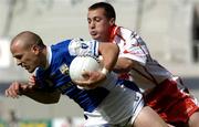 1 August 2004; Tom Kelly, Laois, in action against Brian McGuigan, Tyrone. Bank of Ireland All-Ireland Football Championship, Round 4, Laois v Tyrone, Croke Park, Dublin. Picture credit; Damien Eagers / SPORTSFILE