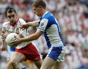 1 August 2004; Brian McDonald, Laois, about to score his sides opening goal despite the challenge of Ryan McMenamin, Tyrone. Bank of Ireland All-Ireland Football Championship, Round 4, Laois v Tyrone, Croke Park, Dublin. Picture credit; Damien Eagers / SPORTSFILE