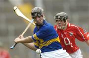 4 August 2004; Francis Devanney, Tipperary, in action against Cork's P.J Copse. Erin Foods Munster U21 Hurling Championship Final, Cork v Tipperary, Semple Stadium, Thurles, Co. Tipperary. Picture credit; Matt Browne / SPORTSFILE