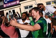 10 May 2024; Barry McCarthy of Ireland takes a selfie with supporters after match one of the Floki Men's T20 International Series between Ireland and Pakistan at Castle Avenue Cricket Ground in Dublin. Photo by Seb Daly/Sportsfile