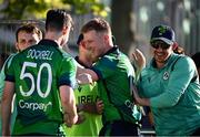 10 May 2024; Harry Tector of Ireland, centre, celebrates with teammates after match one of the Floki Men's T20 International Series between Ireland and Pakistan at Castle Avenue Cricket Ground in Dublin. Photo by Seb Daly/Sportsfile