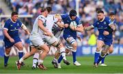 11 May 2024; Ryan Baird of Leinster is tackled by Harri Deaves of Ospreys, hidden, during the United Rugby Championship match between Leinster and Ospreys at the RDS Arena in Dublin. Photo by Ben McShane/Sportsfile