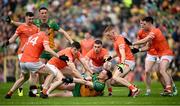 12 May 2024; Ciaran Thompson of Donegal passes under pressure from Armagh players during the Ulster GAA Football Senior Championship final match between Armagh and Donegal at St Tiernach's Park in Clones, Monaghan. Photo by Ramsey Cardy/Sportsfile