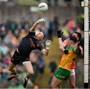 12 May 2024; Armagh goalkeeper Blaine Hughes clears under pressure from Caolan McColgan of Donegal during the Ulster GAA Football Senior Championship final match between Armagh and Donegal at St Tiernach's Park in Clones, Monaghan. Photo by Ramsey Cardy/Sportsfile