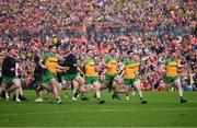 12 May 2024; Donegal players celebrate after their victory in the penalty shoot out during the Ulster GAA Football Senior Championship final match between Armagh and Donegal at St Tiernach's Park in Clones, Monaghan. Photo by Ramsey Cardy/Sportsfile