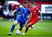 17 May 2024; Dean McMenany of Waterford in action against Evan Caffrey of Shelbourne during the SSE Airtricity Men's Premier Division match between Shelbourne and Waterford at Tolka Park in Dublin. Photo by David Fitzgerald/Sportsfile