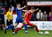17 May 2024; Evan Caffrey of Shelbourne in action against Dean McMenany of Waterford during the SSE Airtricity Men's Premier Division match between Shelbourne and Waterford at Tolka Park in Dublin. Photo by David Fitzgerald/Sportsfile