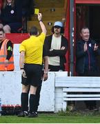 17 May 2024; Waterford manager Keith Long is shown a yellow card by referee Robert Harvey during the SSE Airtricity Men's Premier Division match between Shelbourne and Waterford at Tolka Park in Dublin. Photo by David Fitzgerald/Sportsfile