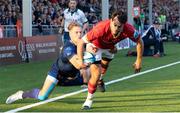 17 May 2024; Antoine Frisch of Munster evades the tackle of Duhan van der Merwe to score a try during the United Rugby Championship match between Edinburgh and Munster at the Hive Stadium in Edinburgh, Scotland. Photo by Mark Scates/Sportsfile