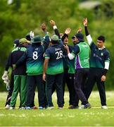 18 May 2024; Limerick players celebrate the taking of a wicket during the Cricket Ireland National Cup Round One match between Limerick and County Galway at The Manor Fields in Adare, Limerick. Photo by Tom Beary/Sportsfile