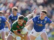18 May 2024; Cillian O'Connor of Mayo in action against Niall Carolan of Cavan during the GAA Football All-Ireland Senior Championship Round 1 match between Mayo and Cavan at Hastings Insurance MacHale Park in Castlebar, Mayo. Photo by Stephen Marken/Sportsfile