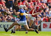 19 May 2024; Alan Connolly of Cork scores his side's first goal despite the efforts of Craig Morgan and Michael Breen of Tipperary during the Munster GAA Hurling Senior Championship Round 4 match between Tipperary and Cork at FBD Semple Stadium in Thurles, Tipperary. Photo by Brendan Moran/Sportsfile