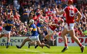 19 May 2024; Alan Connolly of Cork scores his side's first goal despite the efforts of Craig Morgan and Michael Breen of Tipperary during the Munster GAA Hurling Senior Championship Round 4 match between Tipperary and Cork at FBD Semple Stadium in Thurles, Tipperary. Photo by Brendan Moran/Sportsfile