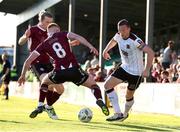 24 May 2024; John Mountney of Dundalk in action against Aodh Dervin of Galway United during the SSE Airtricity Men's Premier Division match between Galway United and Dundalk at Eamonn Deacy Park in Galway. Photo by Michael P Ryan/Sportsfile