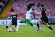 24 May 2024; Jaden Umeh of Cork City is tackled by Leon Kirrane, left, and Ben O'Riordan of Treaty United which subsequently resulted in an injury for the Cork City player during the SSE Airtricity Men's First Division match between Cork City and Treaty United at Turner's Cross in Cork. Photo by Tyler Miller/Sportsfile