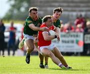 25 May 2024; Sam Mulroy of Louth in action against Seán Coffey, left, and Adam O'Neill of Meath during the GAA Football All-Ireland Senior Championship Round 1 match between Louth and Meath at Grattan Park in Inniskeen, Monaghan. Photo by Daire Brennan/Sportsfile