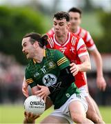 25 May 2024; Cillian O'Sullivan of Meath in action against Craig Lennon of Louth during the GAA Football All-Ireland Senior Championship Round 1 match between Louth and Meath at Grattan Park in Inniskeen, Monaghan. Photo by Daire Brennan/Sportsfile