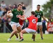 25 May 2024; Ronan Jones of Meath in action against Anthony Williams of Louth during the GAA Football All-Ireland Senior Championship Round 1 match between Louth and Meath at Grattan Park in Inniskeen, Monaghan. Photo by Daire Brennan/Sportsfile