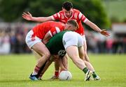 25 May 2024; Cillian O'Sullivan of Meath in action against Dan Corcoran, left, and Craig Lennon of Louth during the GAA Football All-Ireland Senior Championship Round 1 match between Louth and Meath at Grattan Park in Inniskeen, Monaghan. Photo by Daire Brennan/Sportsfile