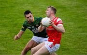 25 May 2024; Paul Mathews of Louth in action against Ciarán Caulfield of Meath during the GAA Football All-Ireland Senior Championship Round 1 match between Louth and Meath at Grattan Park in Inniskeen, Monaghan. Photo by Daire Brennan/Sportsfile