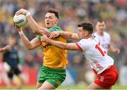 25 May 2024; Jason McGee of Donegal is tackled by Darren McCurry of Tyrone during the GAA Football All-Ireland Senior Championship Round 1 match between Donegal and Tyrone at MacCumhaill Park in Ballybofey, Donegal. Photo by Stephen McCarthy/Sportsfile