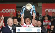 26 May 2024; Derry captain James Sargent lifts the cup after the Electric Ireland Ulster GAA Football Minor Championship final match between Armagh and Derry at O'Neill's Healy Park in Omagh, Tyrone. Photo by Philip Fitzpatrick/Sportsfile