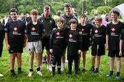 26 May 2024; Connacht rugby players Matt and John Devine pose with X Rugby 7s players during day two of the multi-sports finals of the Cairn Community Games at Gormanston Park in Meath. Photo by Ben McShane/Sportsfile