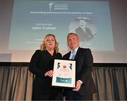 28 May 2024; Eithne Trainor is presented with the Outstanding Achievement Award on behalf of her late husband, ONSIDE founder John Trainor, by Minister for Finance Michael McGrath TD during the 2024 Irish Sport Industry Sport Awards at College Green Hotel in Dublin. Photo by Sam Barnes/Sportsfile