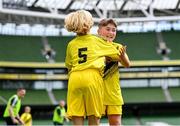 29 May 2024; Conor Farrell, right, and Lewis Quinn of St Eunan’s NS, Raphoe, Donegal, celebrate scoring a goal in the B Cup, for mixed medium sized schools, during the FAI Primary 5s Finals day at Aviva Stadium in Dublin. Photo by Stephen McCarthy/Sportsfile