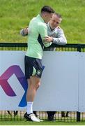 31 May 2024; Dara O'Shea with Republic of Ireland U21 manager Jim Crawford during a Republic of Ireland training session at the FAI National Training Centre in Abbotstown, Dublin. Photo by Stephen McCarthy/Sportsfile