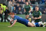 31 May 2024; Ciarán Frawley of Leinster scores his side's third try despite the tackle of Conor Oliver of Connacht during the United Rugby Championship match between Leinster and Connacht at the RDS Arena in Dublin. Photo by Sam Barnes/Sportsfile