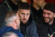 31 May 2024; Injured Shelbourne player Keith Ward in conversation with Republic of Ireland internationals, from left, Matthew Doherty and Robbie Brady during the SSE Airtricity Men's Premier Division match between Shelbourne and Sligo Rovers at Tolka Park in Dublin. Photo by Tom Beary/Sportsfile