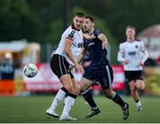 31 May 2024; Zak Johnson of Dundalk in action against Patrick Hoban of Derry City during the SSE Airtricity Men's Premier Division match between Dundalk and Derry City at Oriel Park in Dundalk, Louth. Photo by Michael P Ryan/Sportsfile