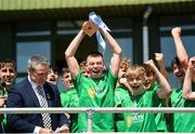 1 June 2024; Ronan Brennan of Fermanagh holds aloft the Electric Ireland Corn Tom Hogan Celtic Challenge trophy after the Electric Ireland Corn Tom Hogan Celtic Challenge final match between Fermanagh and Leitrim at Fr Tierney Park in Ballyshannon, Donegal. Photo by Oliver McVeigh/Sportsfile