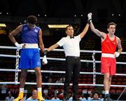 1 June 2024; Aidan Walsh of Ireland is announced victorious over Jorge Cuellar of Cuba after their Men's 71kg box-off round one bout at the Paris 2024 Olympic Boxing Qualification Tournament at Hua Mak Indoor Stadium in Bangkok, Thailand. Photo by Joe Walsh/Sportsfile