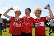 1 June 2024; Cork supporters from left Ali May Kirwan, Age 11, Amy O'Callaghan, Age 11, and Ruby Mehigan, Age 10, celebrate after the GAA Football All-Ireland Senior Championship Round 2 match between Cork and Donegal at Páirc Uí Rinn in Cork. Photo by Matt Browne/Sportsfile