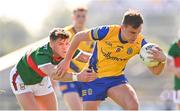1 June 2024; Enda Smith of Roscommon is tackled by Jordan Flynn of Mayo during the GAA Football All-Ireland Senior Championship Round 2 match between Roscommon and Mayo at Dr Hyde Park in Roscommon. Photo by Ben McShane/Sportsfile