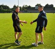 1 June 2024; Carlow manager Niall Carew shakes hands with Wicklow manager Oisín McConville after the Tailteann Cup Group 3 Round 4 match between Wicklow and Carlow at Parnell Park in Dublin. Photo by Daire Brennan/Sportsfile
